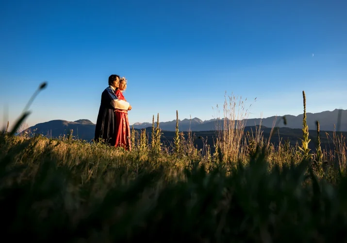 Newlyweds in a hug during their after - wedding session in the Canadian Rocky Mountains.