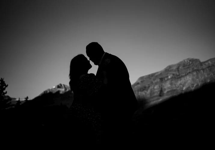 Banff engagement announcement during engagement photo session of silhouette couple in the mountains.