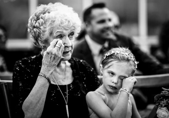 Mather and granddaughter cry during wedding ceremony.