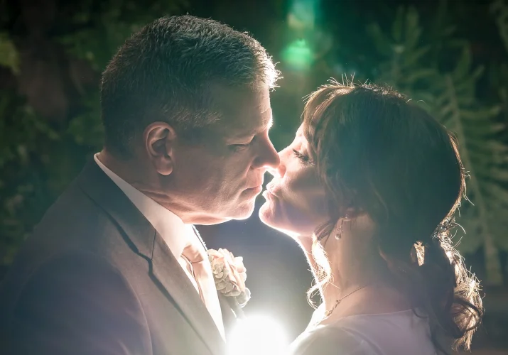 Intimate kiss of the newlyweds.