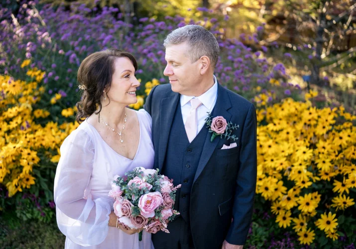 Newlyweds share romantic kiss.