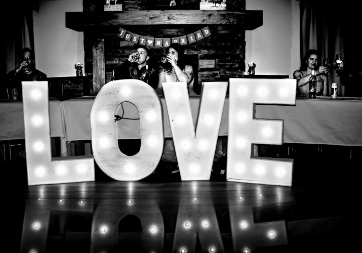 Giant love sigh in front of the newlyweds table.