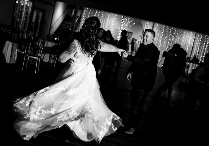 Fantastic moment of on the dance-floor captured by Calgary Wedding Photographer of newlyweds dancing.