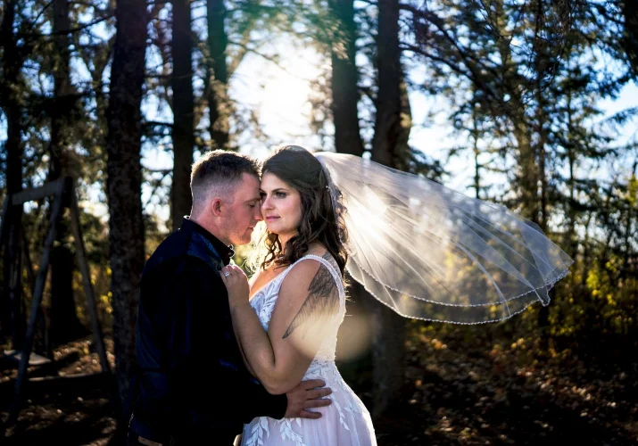 Calgary After-Wedding portrait of bride and groom hugging each other.