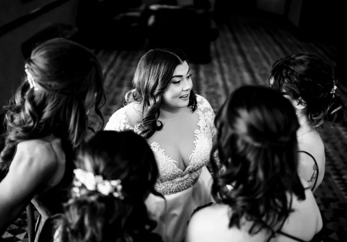 Moment of the bride and her sisters talking captured by best Banff Wedding Photographer.