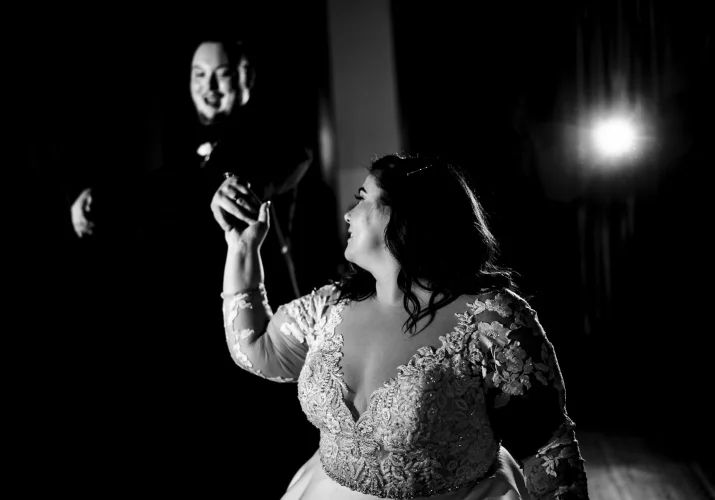 First dance of the bride and groom during Banff Wedding Reception. Bride look at the groom while he smiles to her.