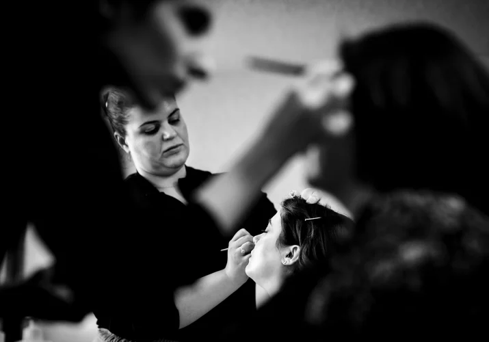 Bride and her bridesmaid get make-up done before Banff Wedding.