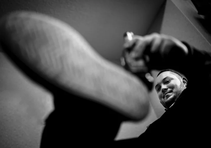 shoot through the hand and leg of the groom drinking beer