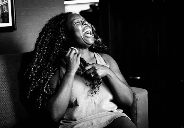 One of the bridesmaids laugh strongly.