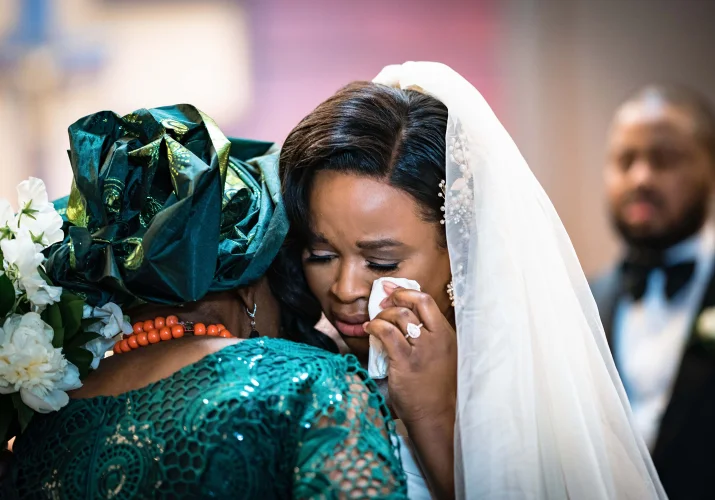 The bride cries while hugging her mother at the Calgary Wedding Ceremony.